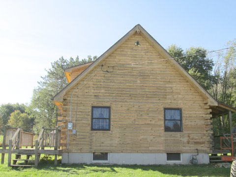 The same wall right after corn cob blasting, showing clean bare wood